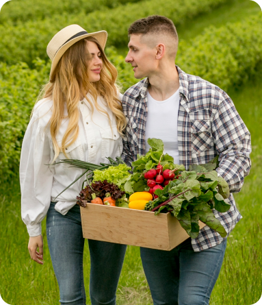 couple with basket of vegetables